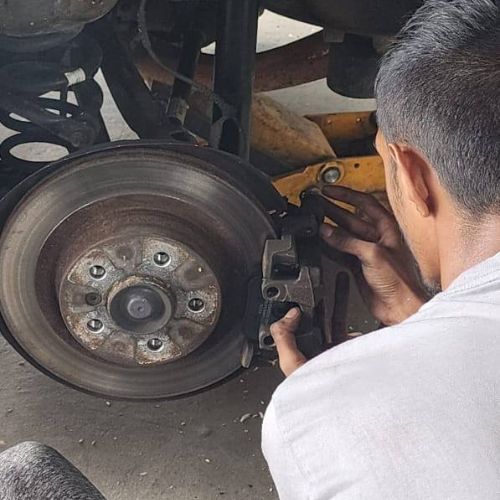 Brake service in a car at Garage Shuhaib.