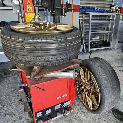 Mounting tyres in car rims.